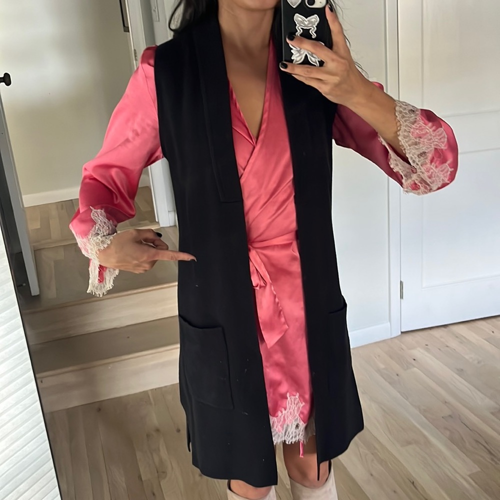 Sleeveless warm knit cardigan.